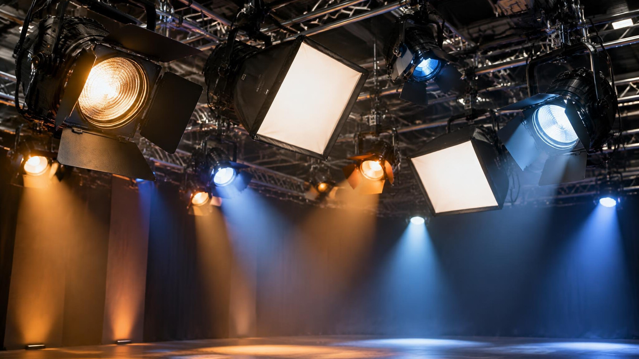 Studio lighting rig with spotlights hanging from a grid